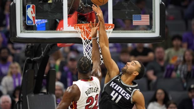 Oct 29, 2022; Sacramento, California, USA; Sacramento Kings forward Trey Lyles (41) blocks a shot by Miami Heat forward Jimmy Butler (22) during the third quarter at Golden 1 Center. Mandatory Credit: Darren Yamashita-USA TODAY Sports
